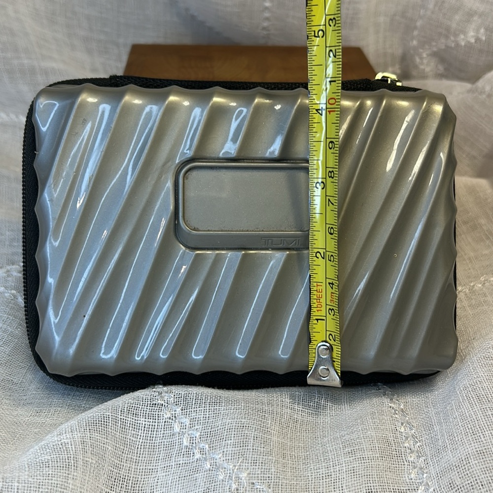 Tumi hard case luggage cosmetic bag filled with goodies for your next trip - Picture 3 of 10